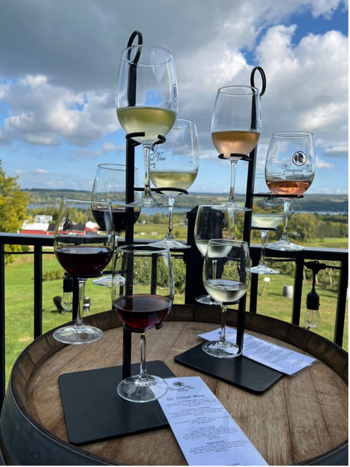 A tower holding wine glasses for tasting.