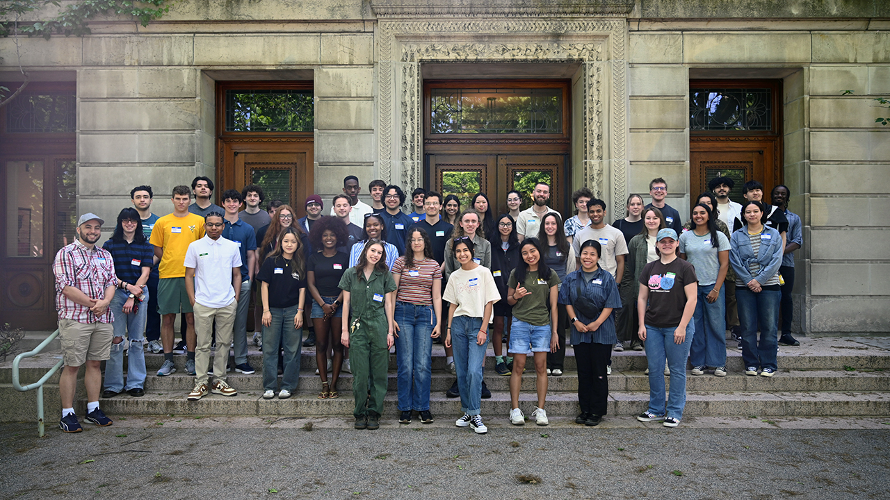 The 2026 cohort of summer scholars standing outside Dewey Hall.