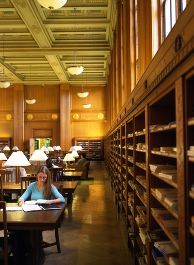 student reads in Rush Rhees Library