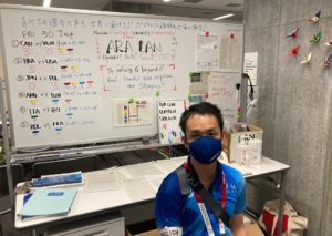 Yuske Shimizu ’02 with a whiteboard used in the Ariake Arena