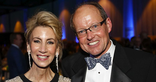 Peter J. Landers ’83 (MS) and Kathleen E. Landers ’82 smiling for camera at a formal event