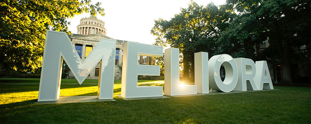 Meliora letters on the quad