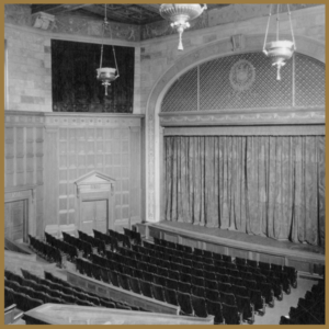 black and white image of empty interior Kilbourn Hall