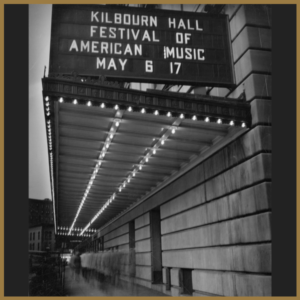 black and white image of marquee listing dates for festival of american music