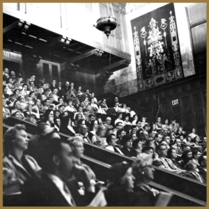 black and white image of full audience at concert in Eastman Hall