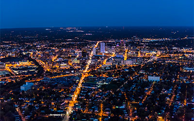 night aerial photo of campus and city