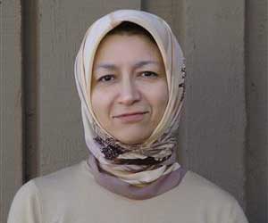 Maha Elgenaidi wearing a tan head scarf