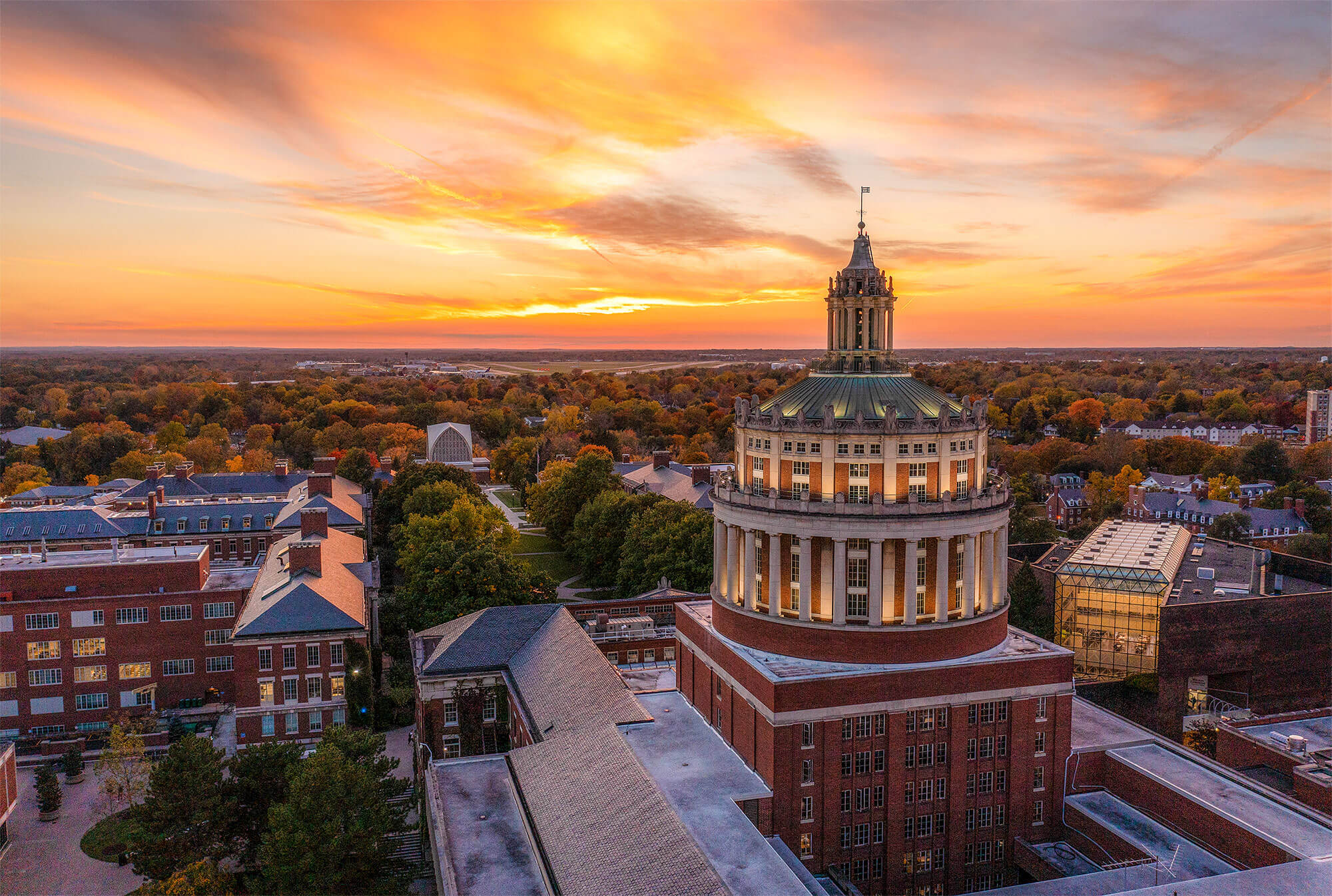 aerial of rush rhees tower overlooking the river campus