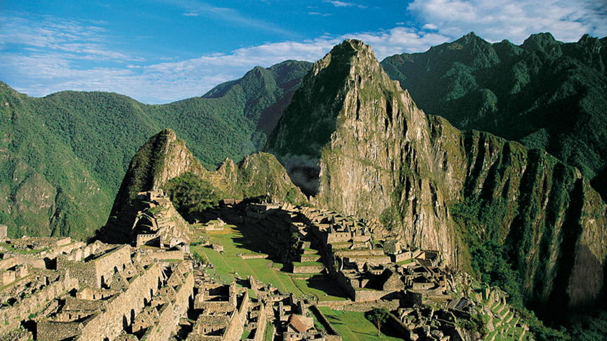 mountains in peru in the background and rock structures in foreground