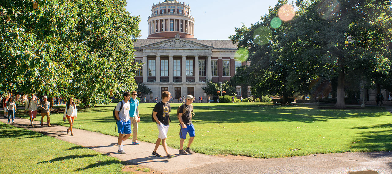 Students walking on the Eastman Quad.