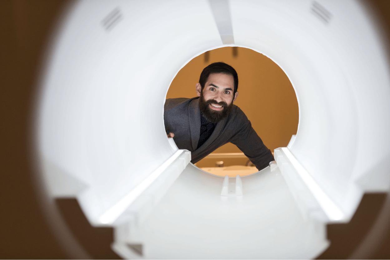David Dodell Feder looks into an MRI machine.