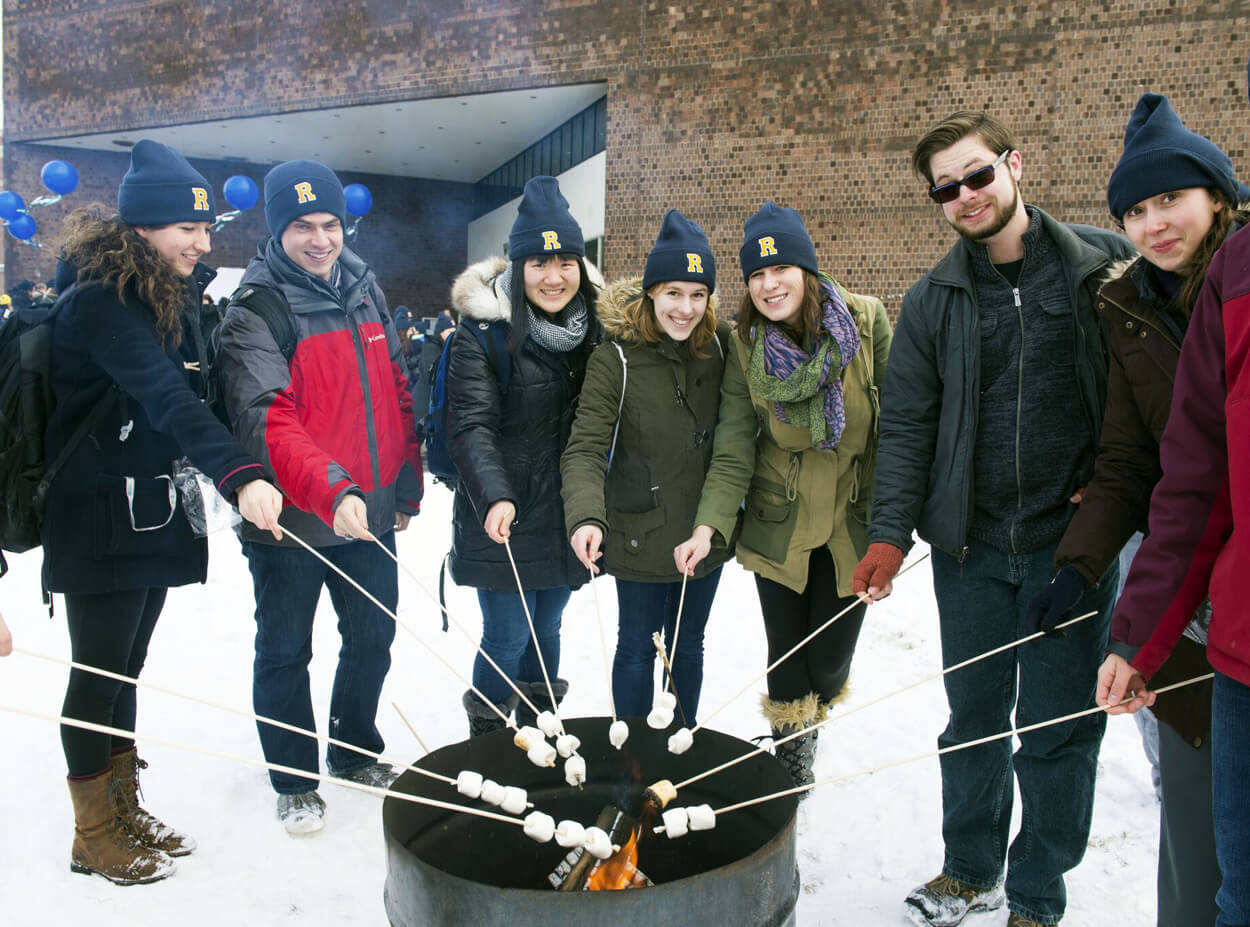 Students roast marshmallows during Winterfest tradition at the University of Rochester