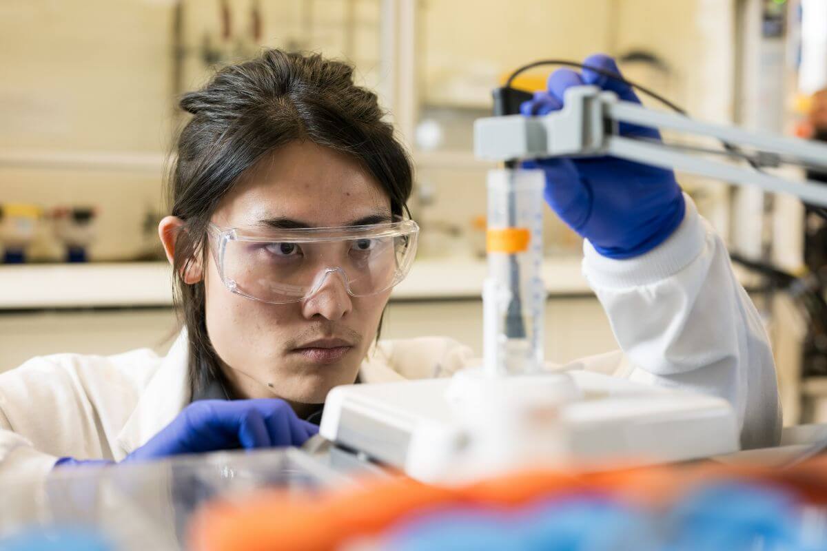Materials science PhD student Ziyi Bruce Meng tests samples of water to see how effective a new electrocatalysis technique developed in the lab of Assistant Professor is at remediating perfluorooctane sulfonate (PFOS) pollution at University of Rochester Hajim School of Engineering and Applied Sciences.