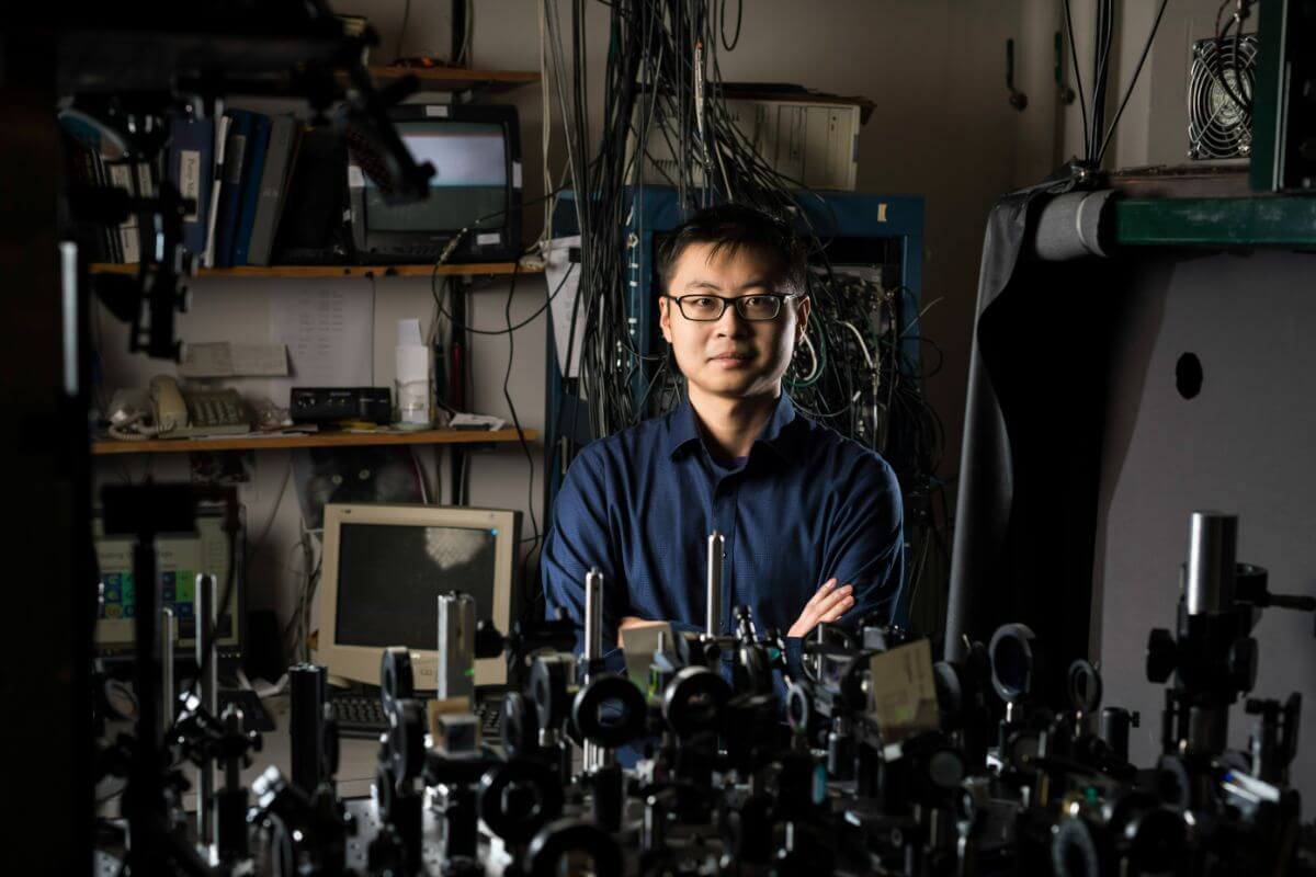 PhD student Zekai Chen is photographed in the lab of his advisor, physics professor Nicholas P. Bigelow, in Bausch & Lomb Hall.