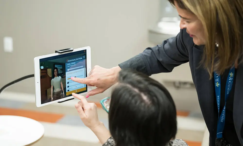 Two people seen from behind tapping on an iPad to customize an AI avatar.'