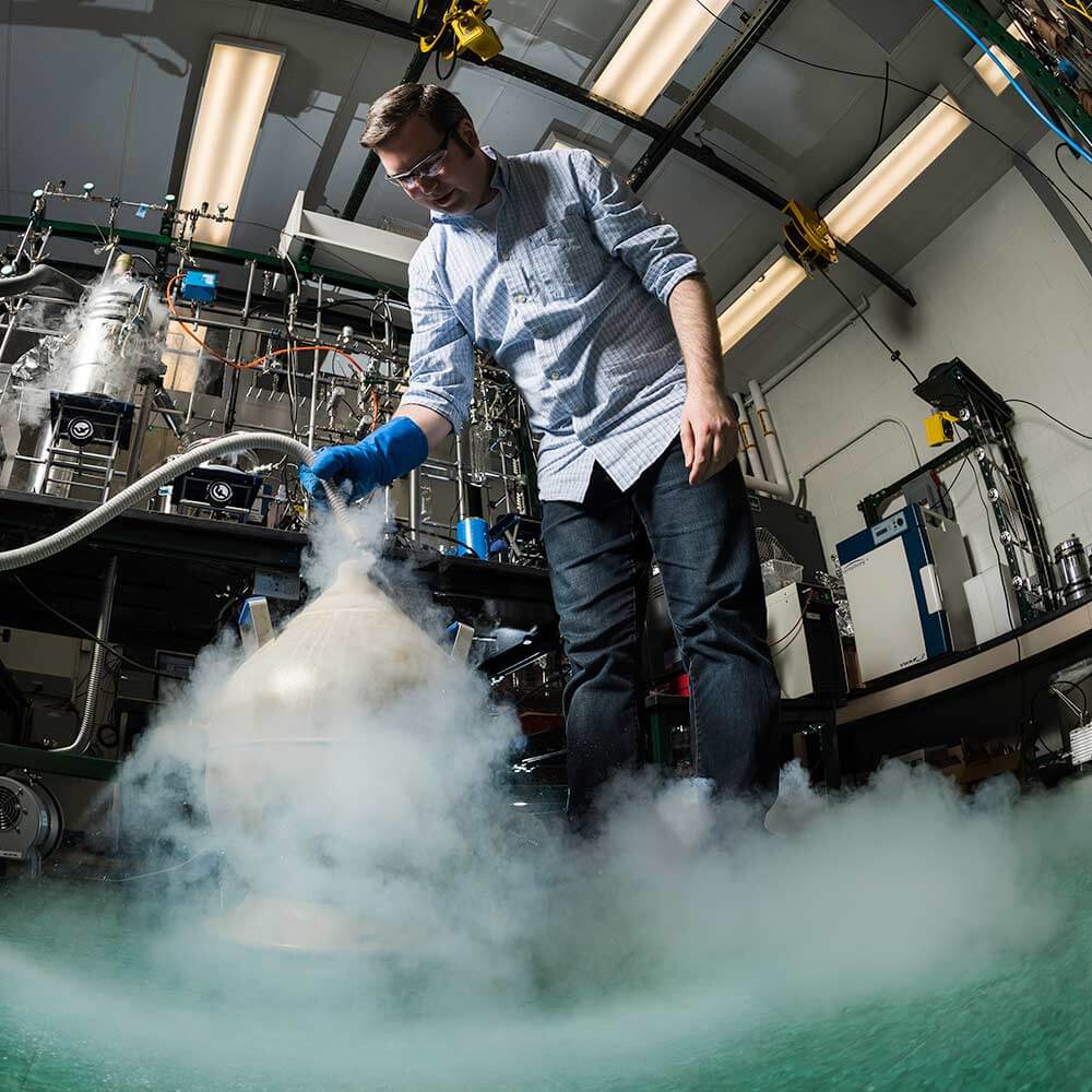 researcher using dry ice in a lab setting