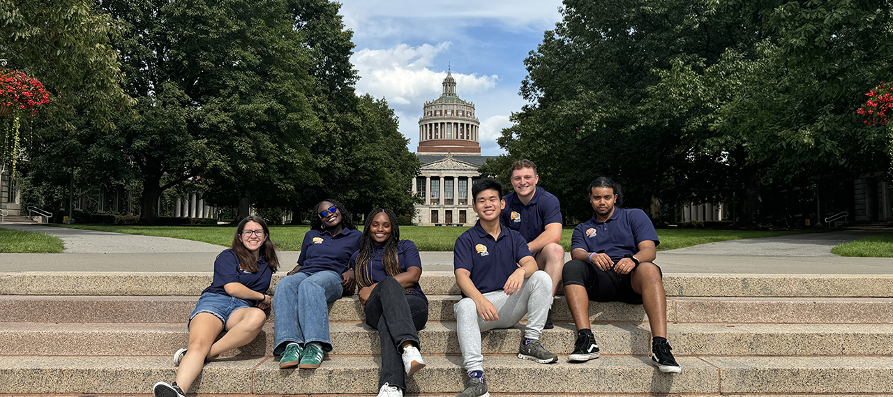 Peer advisors posing in front of Lattimore Hall.