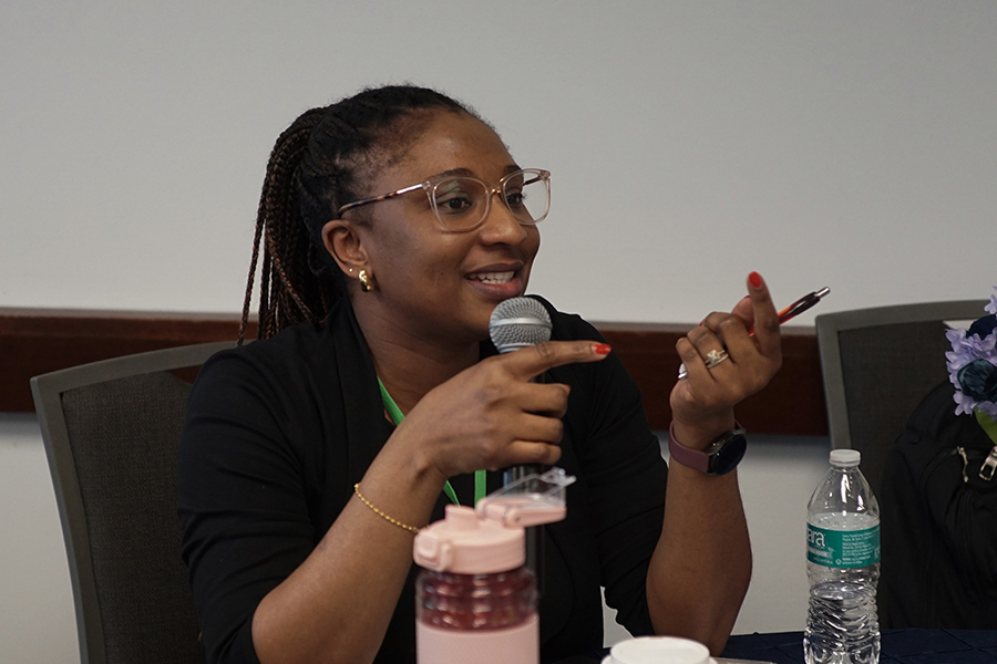 An audience member speaking into a microphone.