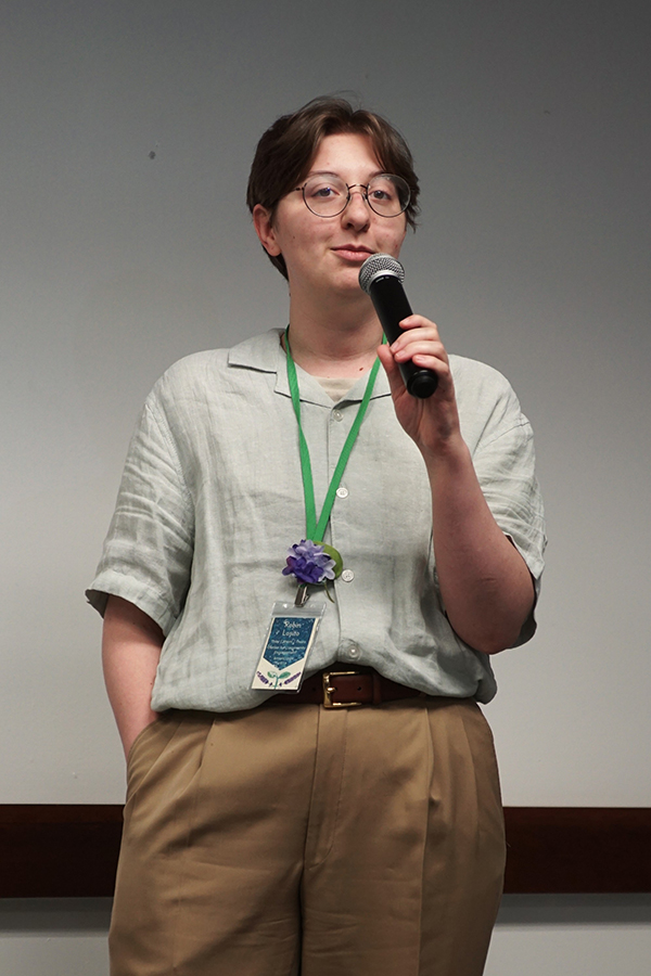 A person with a microphone speaking.
