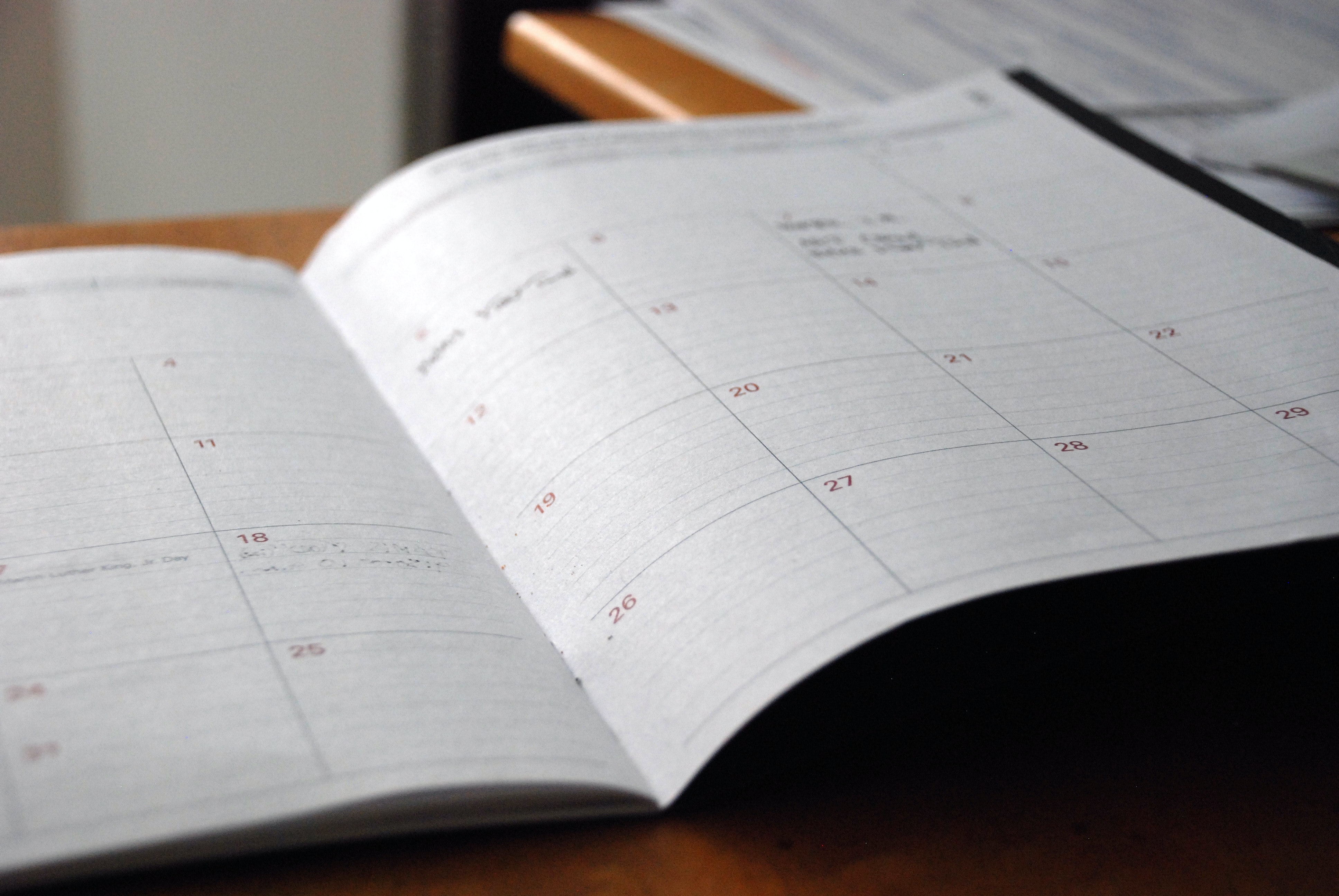 photo of a calendar book open to a monthly calendar