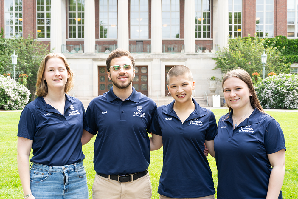 2026-27 Orientation Leaders pose in front of Rush Rhees Library on Eastman Quad