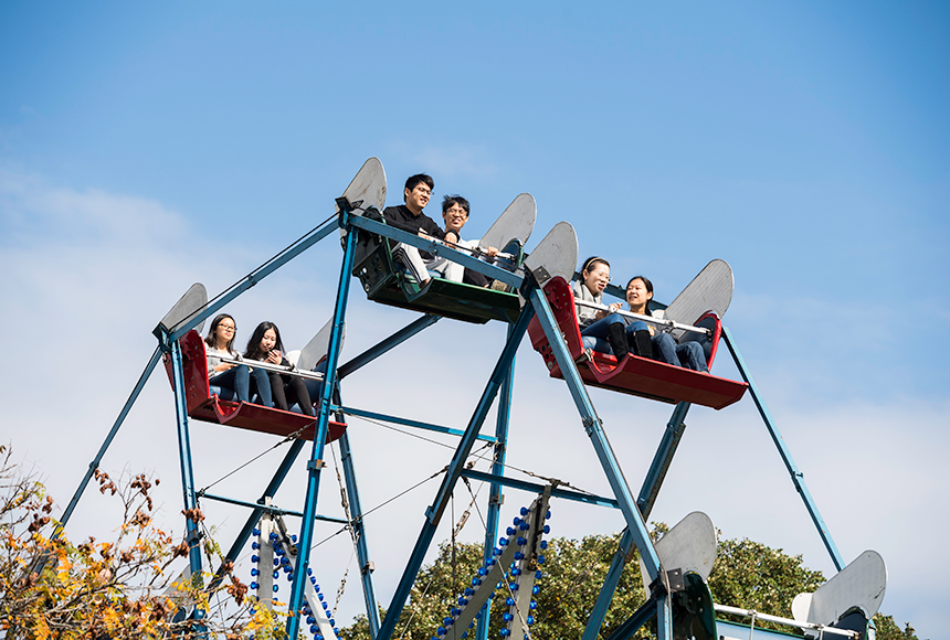Photo of students riding a ferris wheel on campus