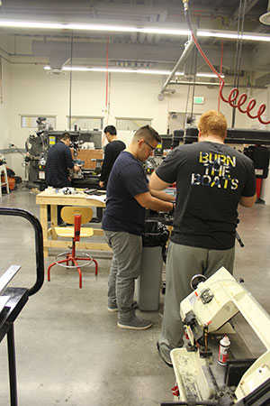 Students working in fabrication shop