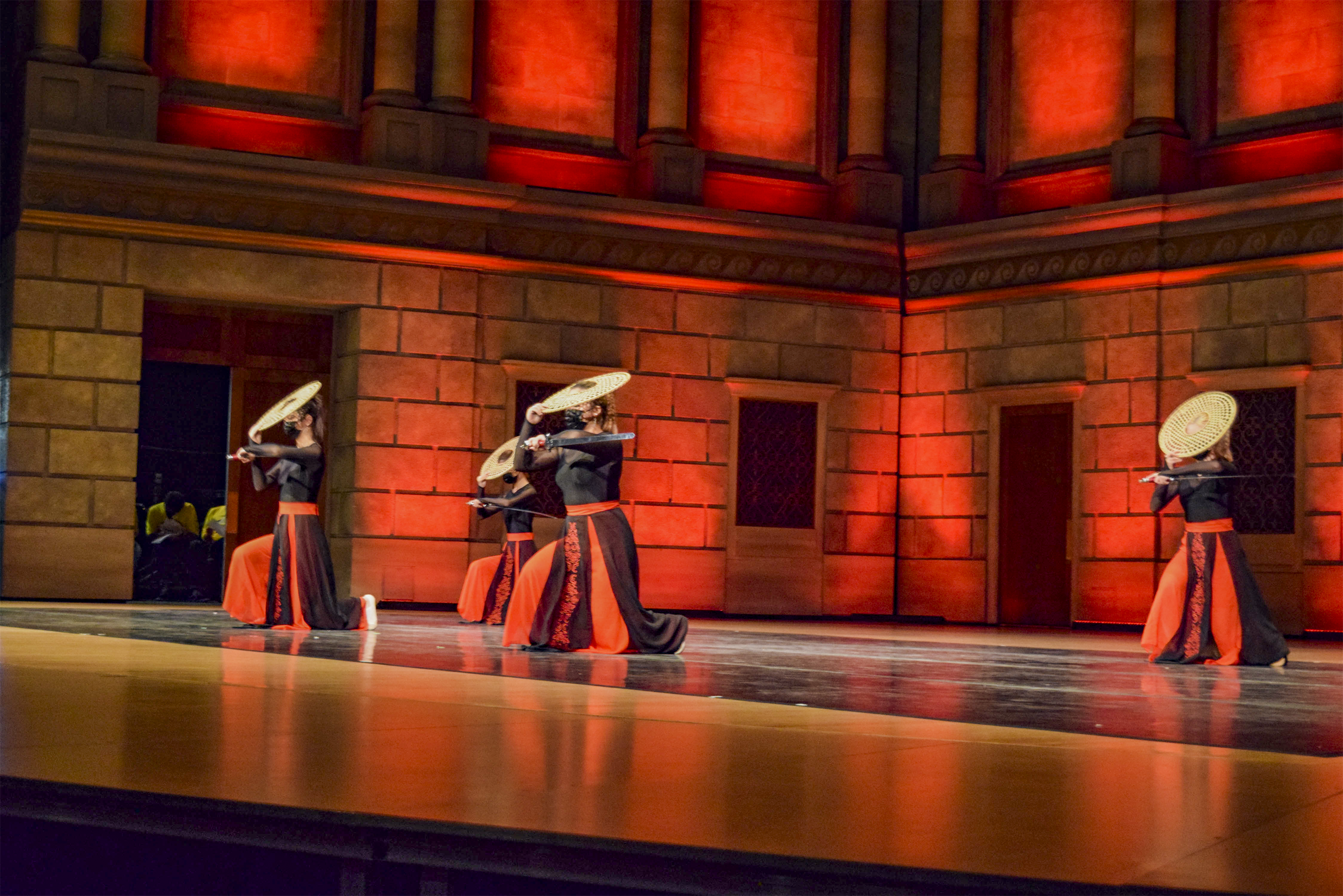 Student sword dance performance on stage