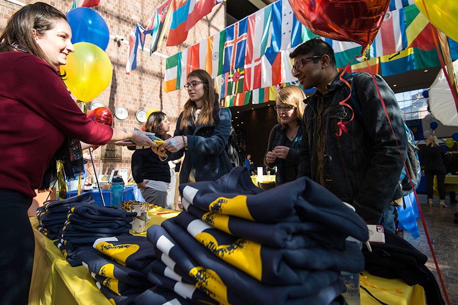 Students receiving tshirst at I heart Rochester Day.