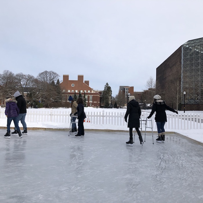 Students skating on ice rink