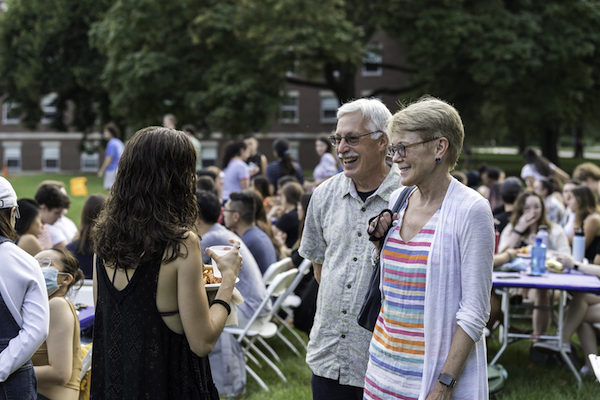 University of Rochester president Sarah Mangelsdorf and husband Karl Rosengren meet with members of the class of '22 at the senior picnic outside Goergen Athletic Center