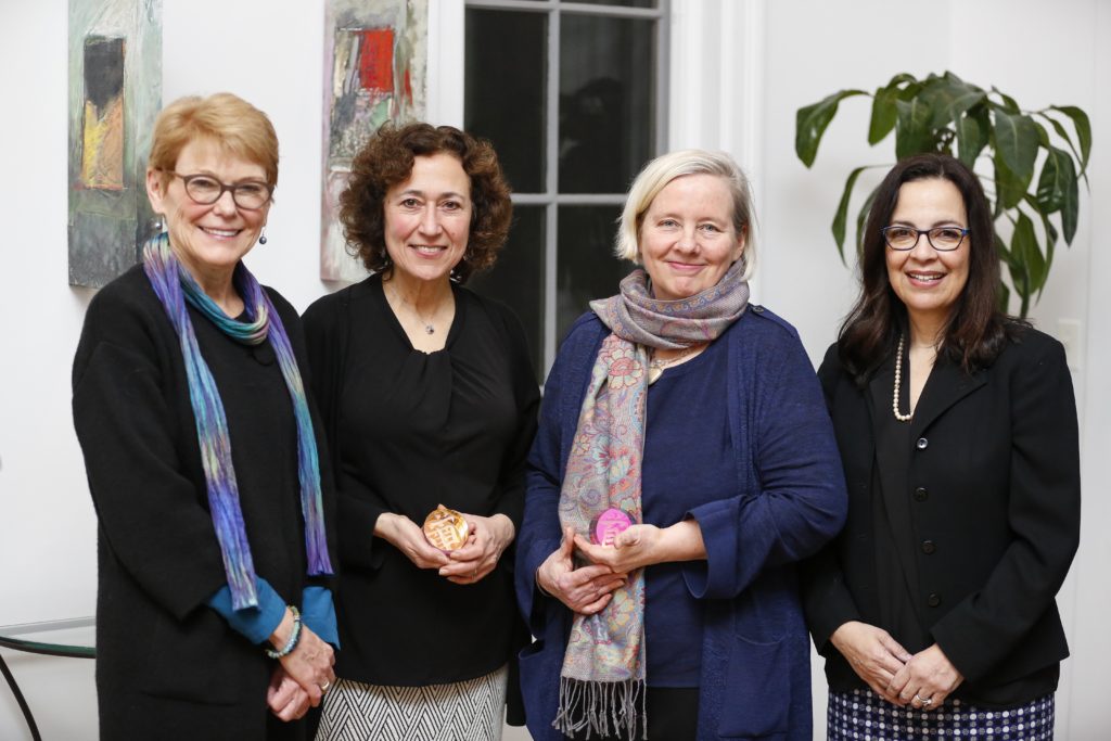 University of Rochester President Sarah Mangelsdorf is posing with three Presidential Diversity Award recipients.