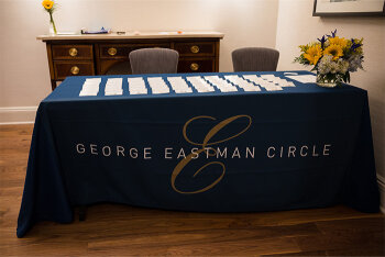 Table with GEC logo table cloth and name cards on it