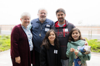 A family of five poses for a photo at the George Eastman Circle Family Celebration, held April 30, 2023, within Washington, DC.