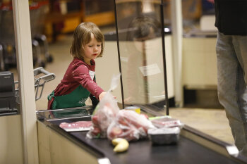 A girl playing as a cashier
