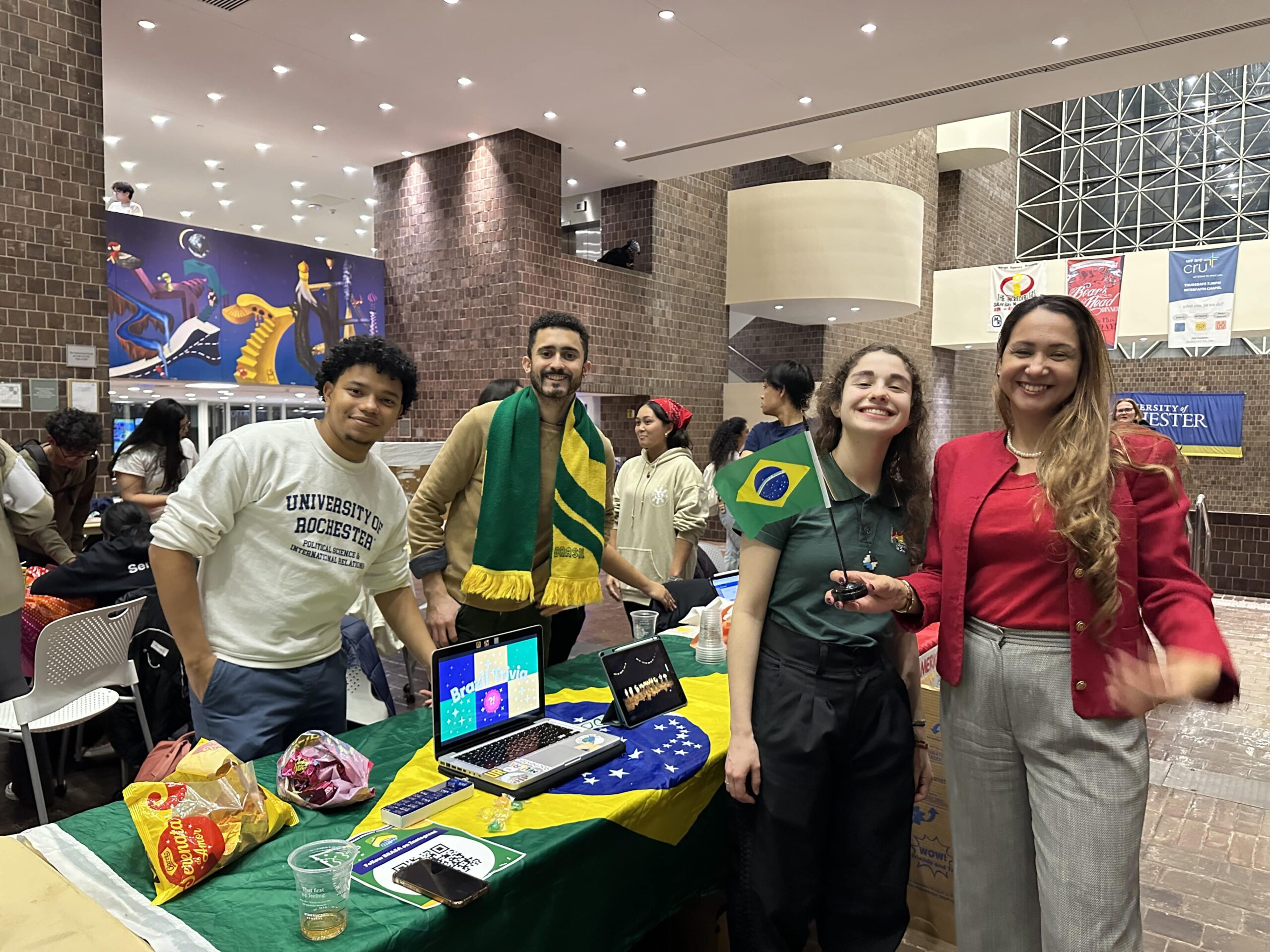 Students show off their Brazilian pride at the Brazil table at the Global Fair, an event sponsored through Global Engagement support.