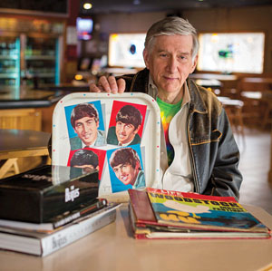 Ned Ferguson '66 with some of his Beatles memorabilia. (Andy Manis / AP Images for Rochester Review)