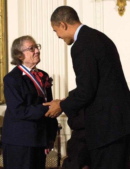 Esther Conwell shaking hands with President Obama. 