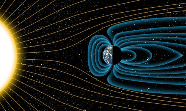 artist's illustration of the Earth's magnetic field deflecting energy from the sun