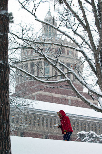 woman walking through a snowstorm