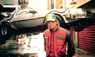 Michael J. Fox as Marty McFly poses with flying car