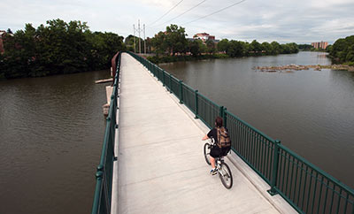 cyclist on pedestrian bridge