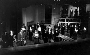 cast on stage in black and white photo