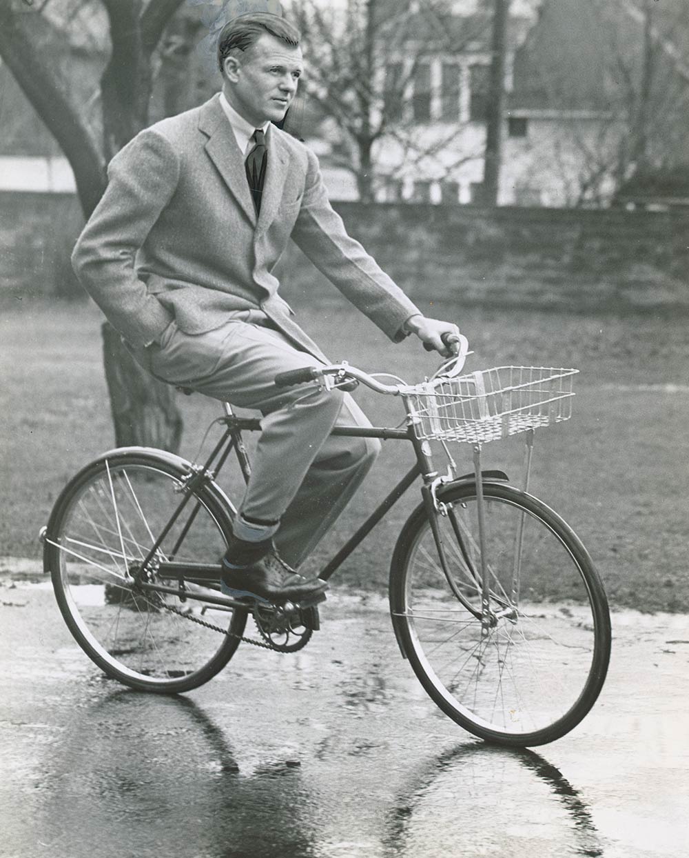 historic photo of man on bicycle