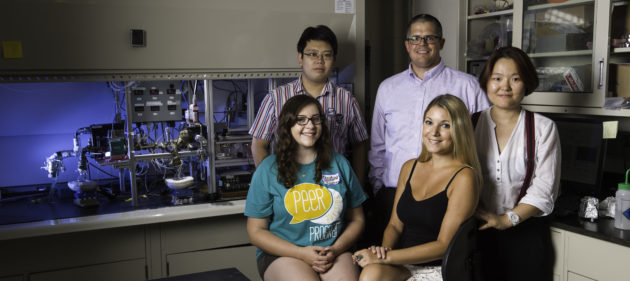 Wyatt Tenhaeff, assistant professor of chemical engineering, with lab members (from left to right) Zhuo Li, Christina Engler, Marina Ioanniti, and Yifan Gao. (Photo by J. Adam Fenster / University of Rochester)
