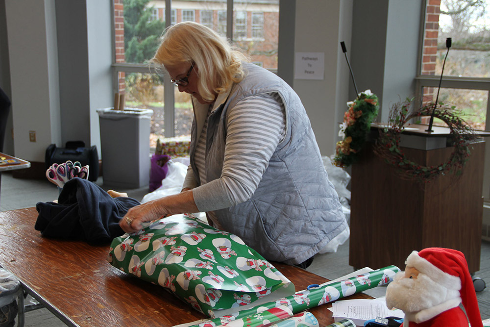woman wrapping a present