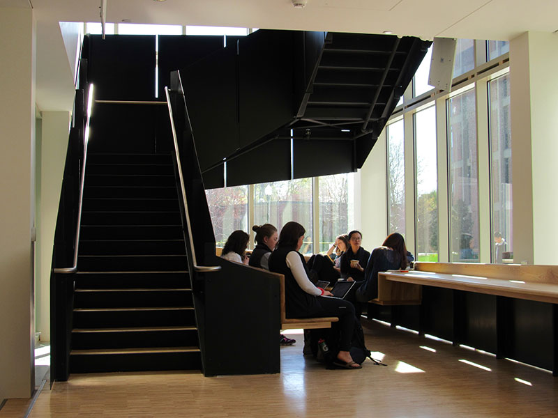 students sitting in a window seat