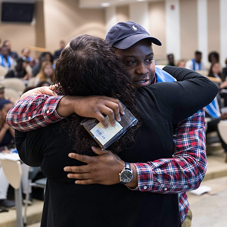 man hugging woman