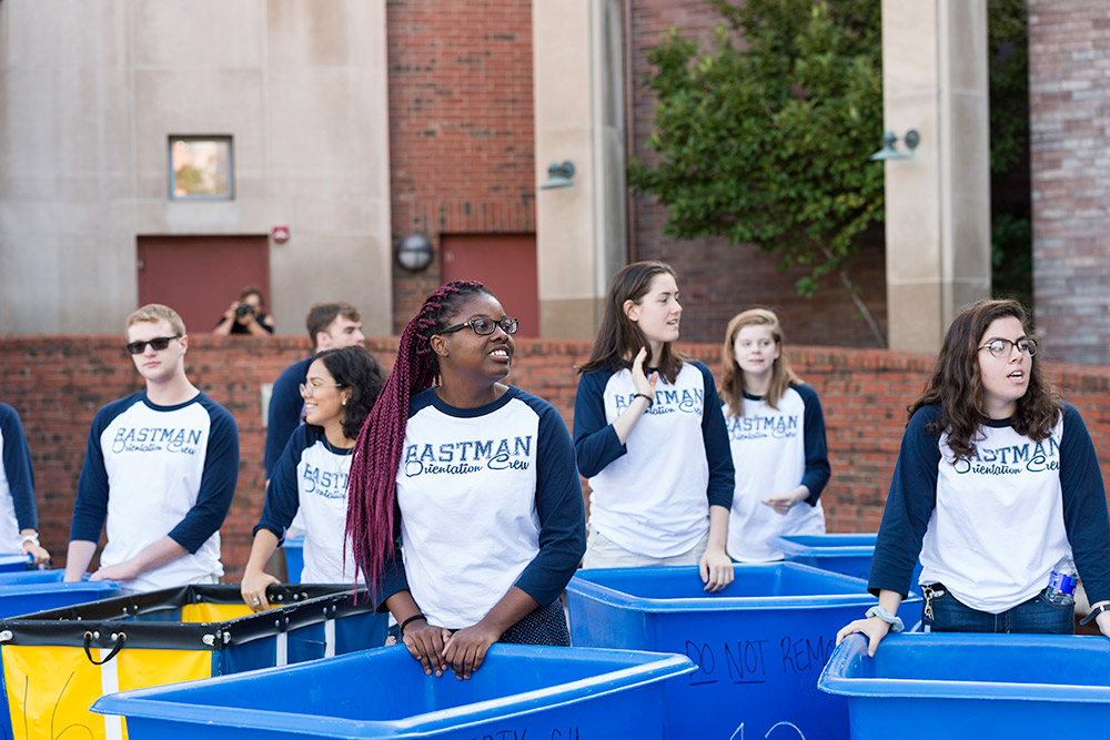 large group of students, each with blue cart