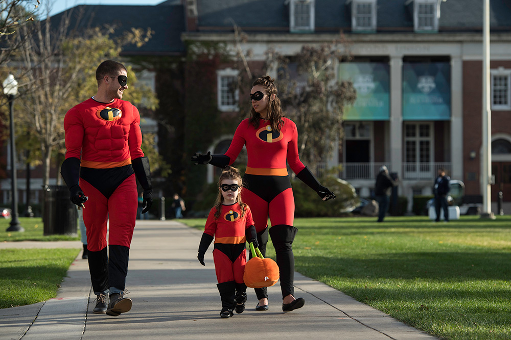 three people dressed as The Incredibles characters